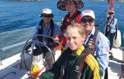 Students and instructors enjoy sailing as part of the Winds of Joy program near Mackay.