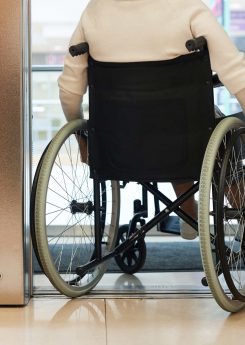 woman in wheelchair entering the elevator
