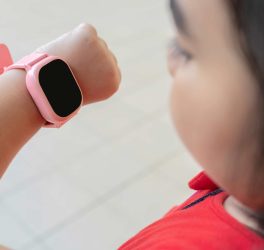 a girl uses a smartwatch