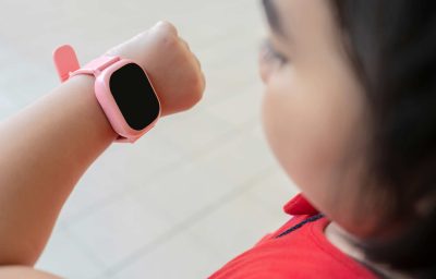 a girl uses a smartwatch