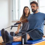 man doing exercise with therapist