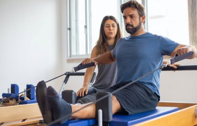 man doing exercise with therapist