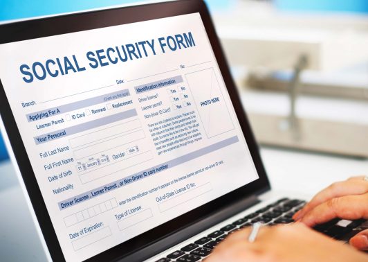 person filling up the social security form online