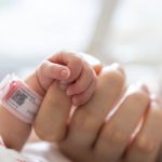 baby hand hold mum index finger