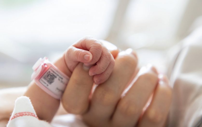 baby hand hold mum index finger