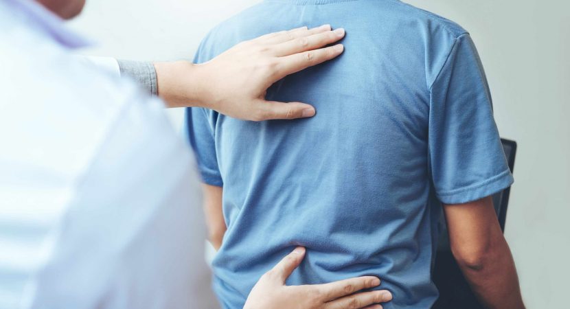 Doctor consulting with patient Back problems