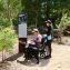 woman in wheelchair with a friend at park