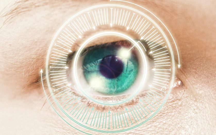 Eye scanning a futuristic interface