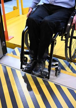 A man in a wheelchair entering accessible coach
