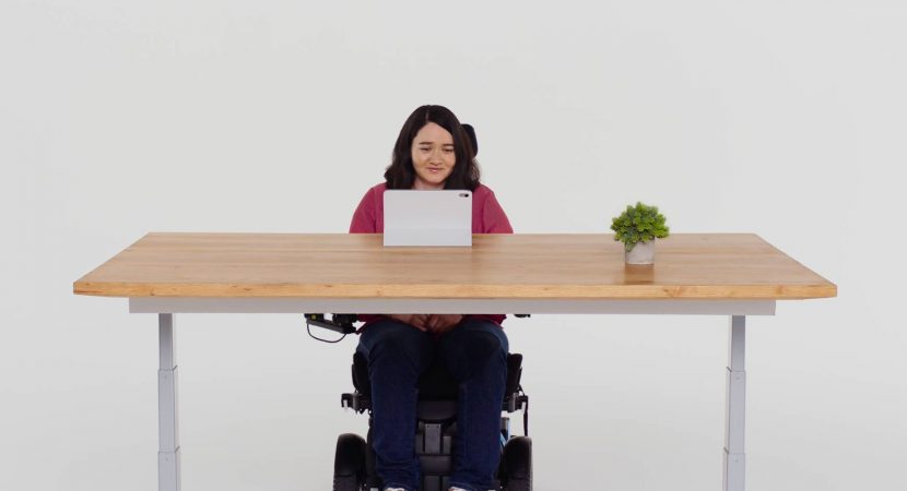 Woman in wheelchair using iPad
