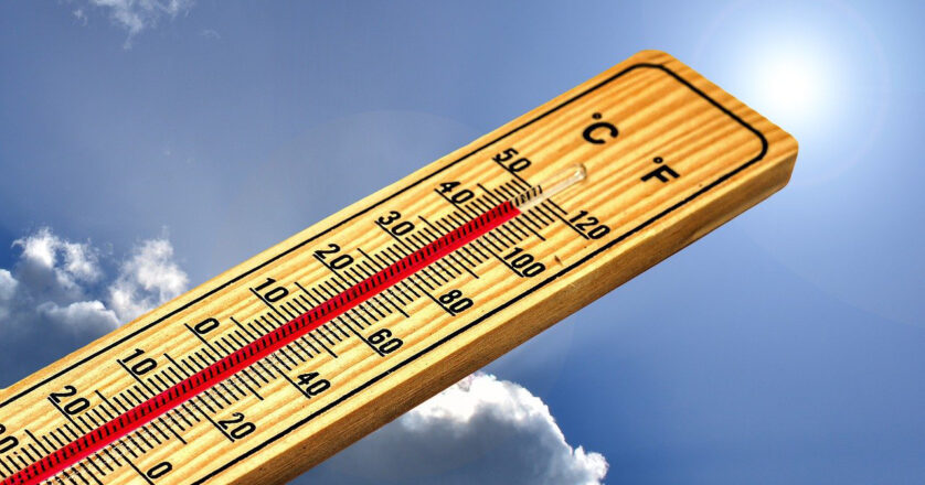 thermometer against blue sky