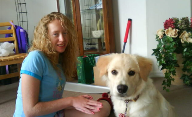 Nikki interacting with a therapy dog