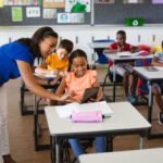 Teacher teaching children in the classroom