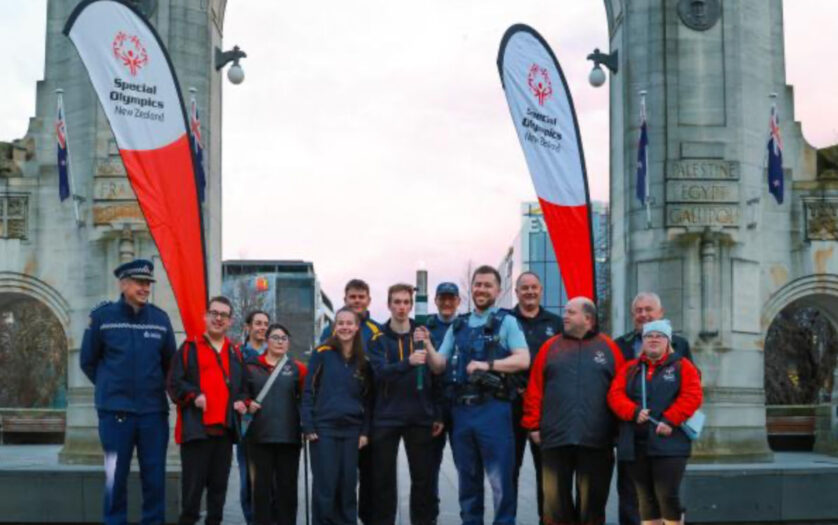 Police and athletes lighting The Flame of Hope in Christchurch