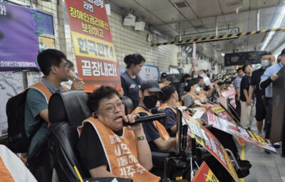 Members of Solidarity Against Disability Discrimination hold a protest