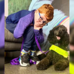 Louis Geary with his assistance dog.