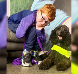 Louis Geary with his assistance dog.