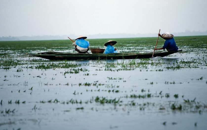 Men Riding Boat on Body of Water, Sunamganj, Sylhet Division, Bangladesh