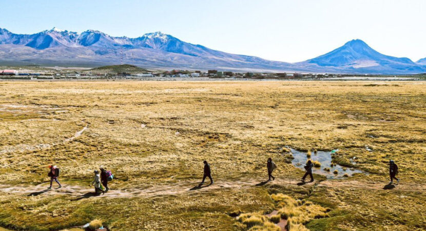 Migrants walk across the Atacama Desert on the Bolivia–Chile border