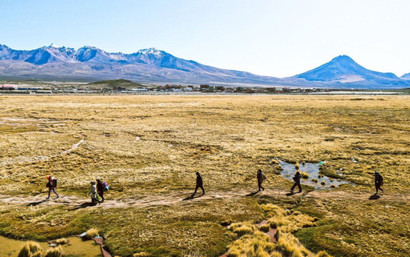 Migrants walk across the Atacama Desert on the Bolivia–Chile border
