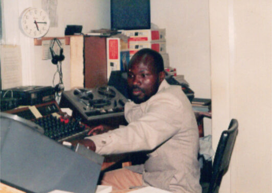 Samson Midigo working in the office