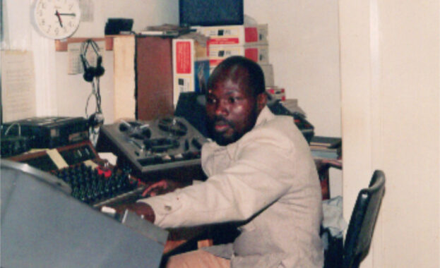 Samson Midigo working in the office