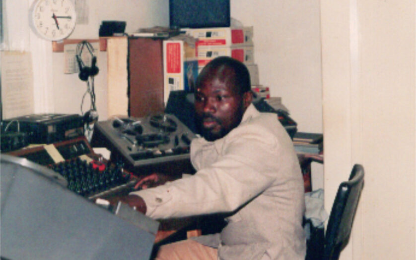 Samson Midigo working in the office
