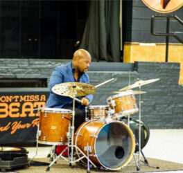 Ulysses Owens Jr playing a drum set