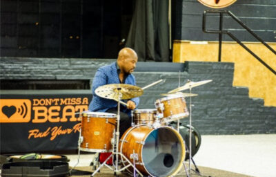 Ulysses Owens Jr playing a drum set