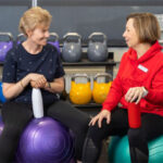 A trainer with person with intellectual disability