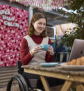 woman in wheelchair using computer