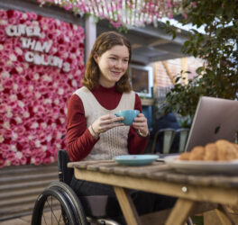 woman in wheelchair using computer