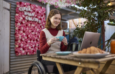 woman in wheelchair using computer