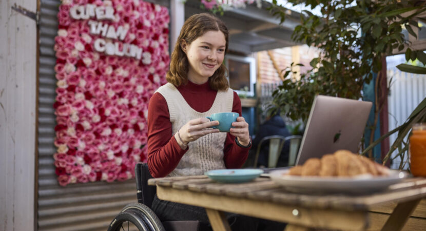 woman in wheelchair using computer