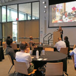 Stephanie Valencia, assistant professor at the University of Maryland, giving a talk on Day One of the Disability and Access in Tech and AI Summit.