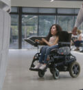 woman in wheelchair inside the building