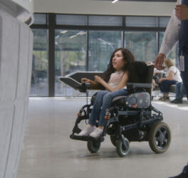 woman in wheelchair inside the building