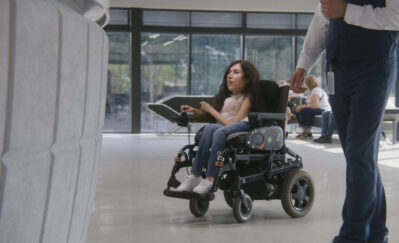 woman in wheelchair inside the building