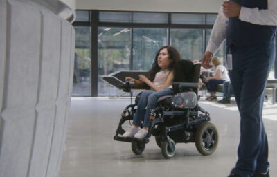 woman in wheelchair inside the building