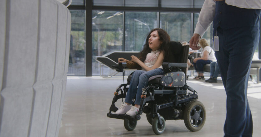woman in wheelchair inside the building