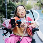 Alice Wong posing for a picture