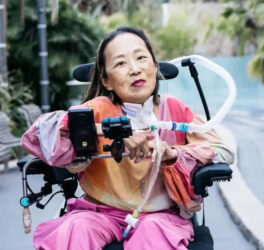 Alice Wong posing for a picture