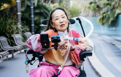 Alice Wong posing for a picture