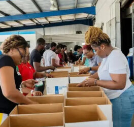 WFP volunteers packing relief supply boxes