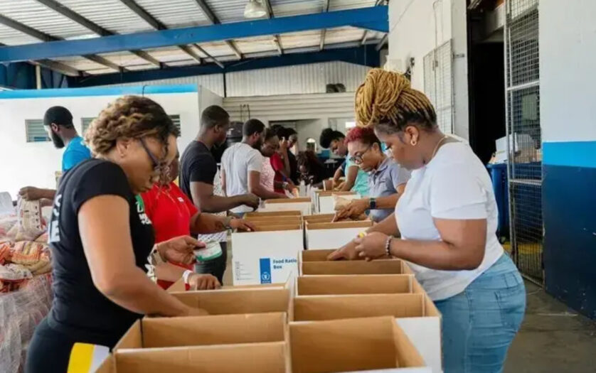 WFP volunteers packing relief supply boxes