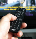 Person Hand Holding Remote Control
