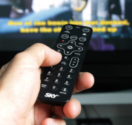 Person Hand Holding Remote Control