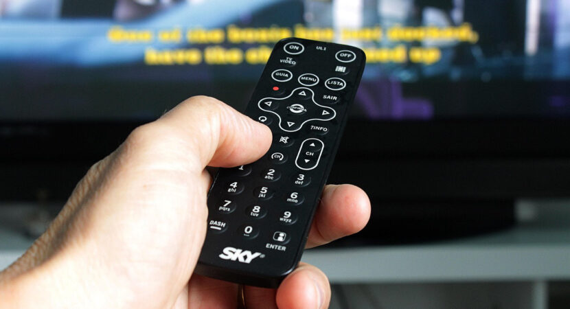Person Hand Holding Remote Control