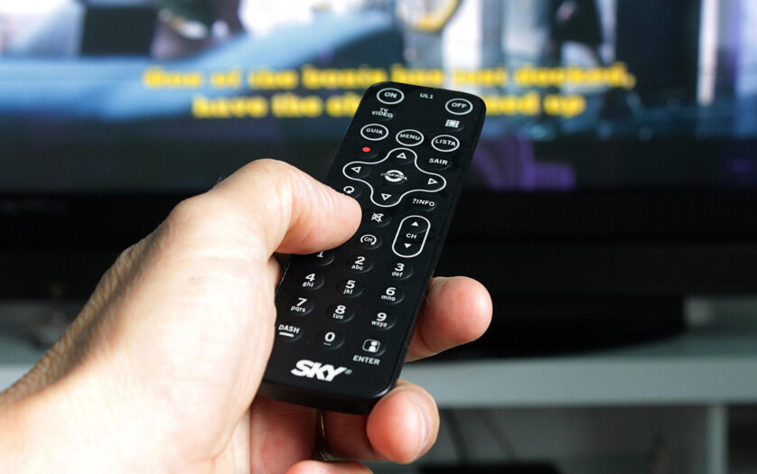 Person Hand Holding Remote Control