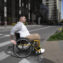 Man in wheelchair crossing the street